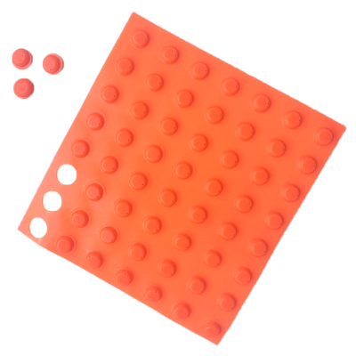 Sheet of orange BumpeSstops with three detached