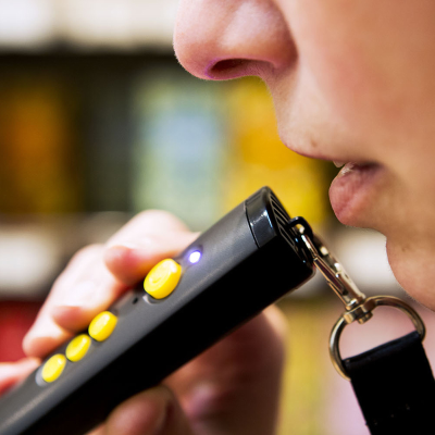 Close-up of mouth recording a message into the RNIB PenFriend mic