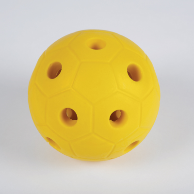 Yellow ball made from hard foam with holes so bells can be heard