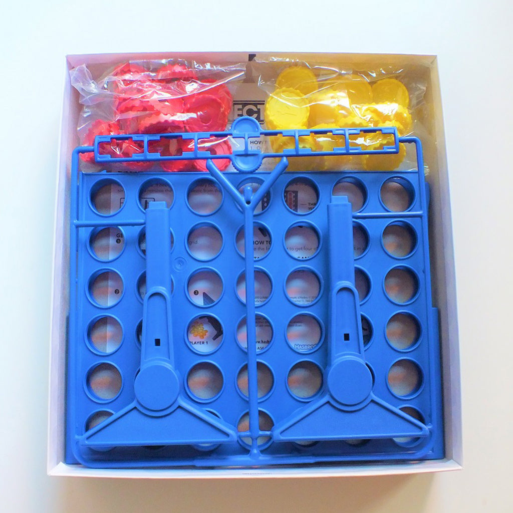 Contents of Connect 4 box showing frame and bags of counters