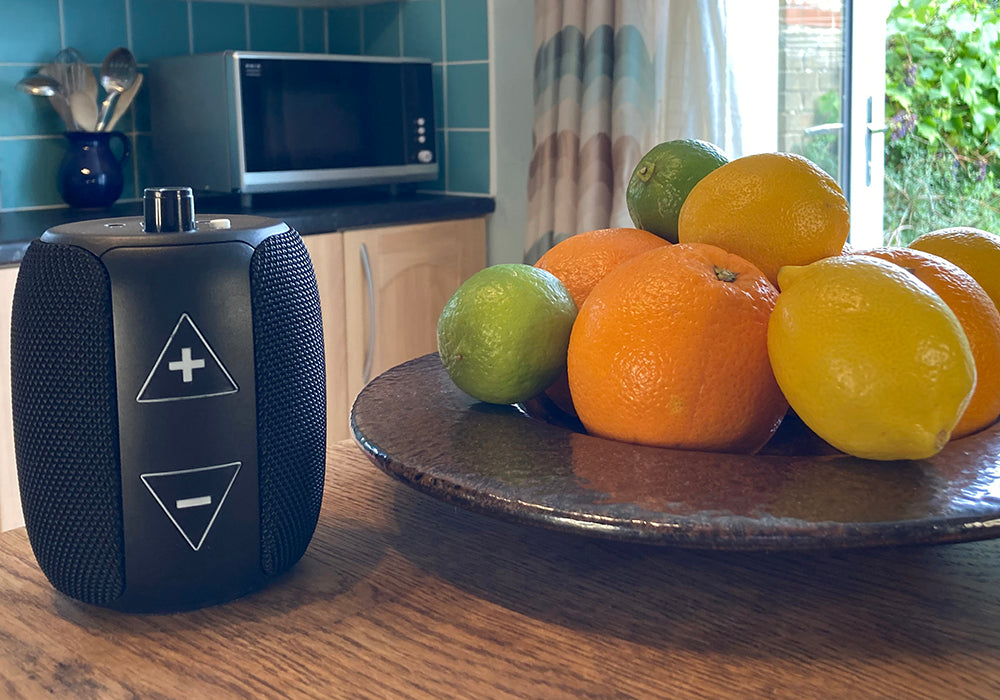 RNIB Accord next to fruit bowl filled with citrus fruit on a wooden breakfast bar