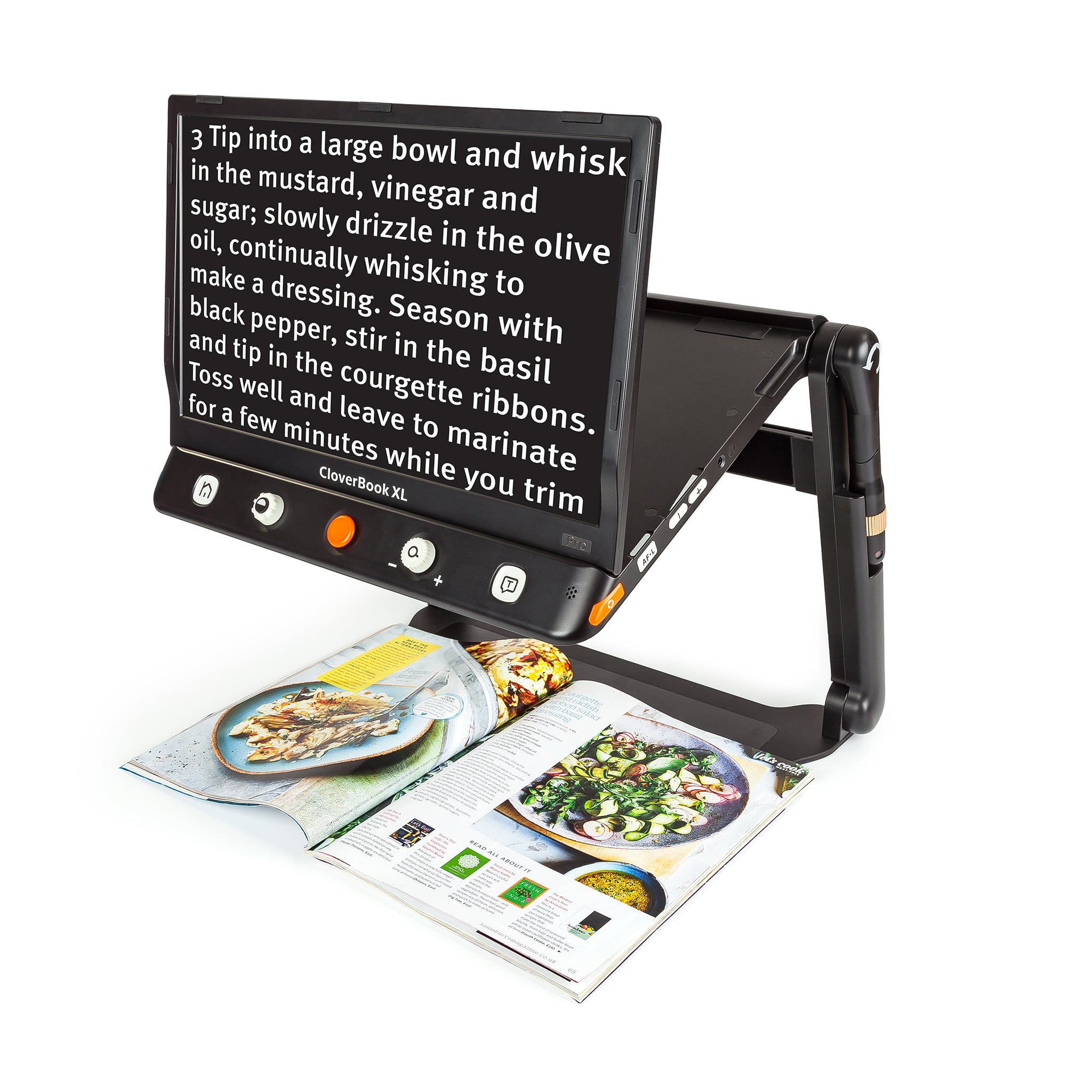 CloverBook XL Pro Plus being used to scan a cookery article in a magazine. The image on the screen shows the text in white against a black background.