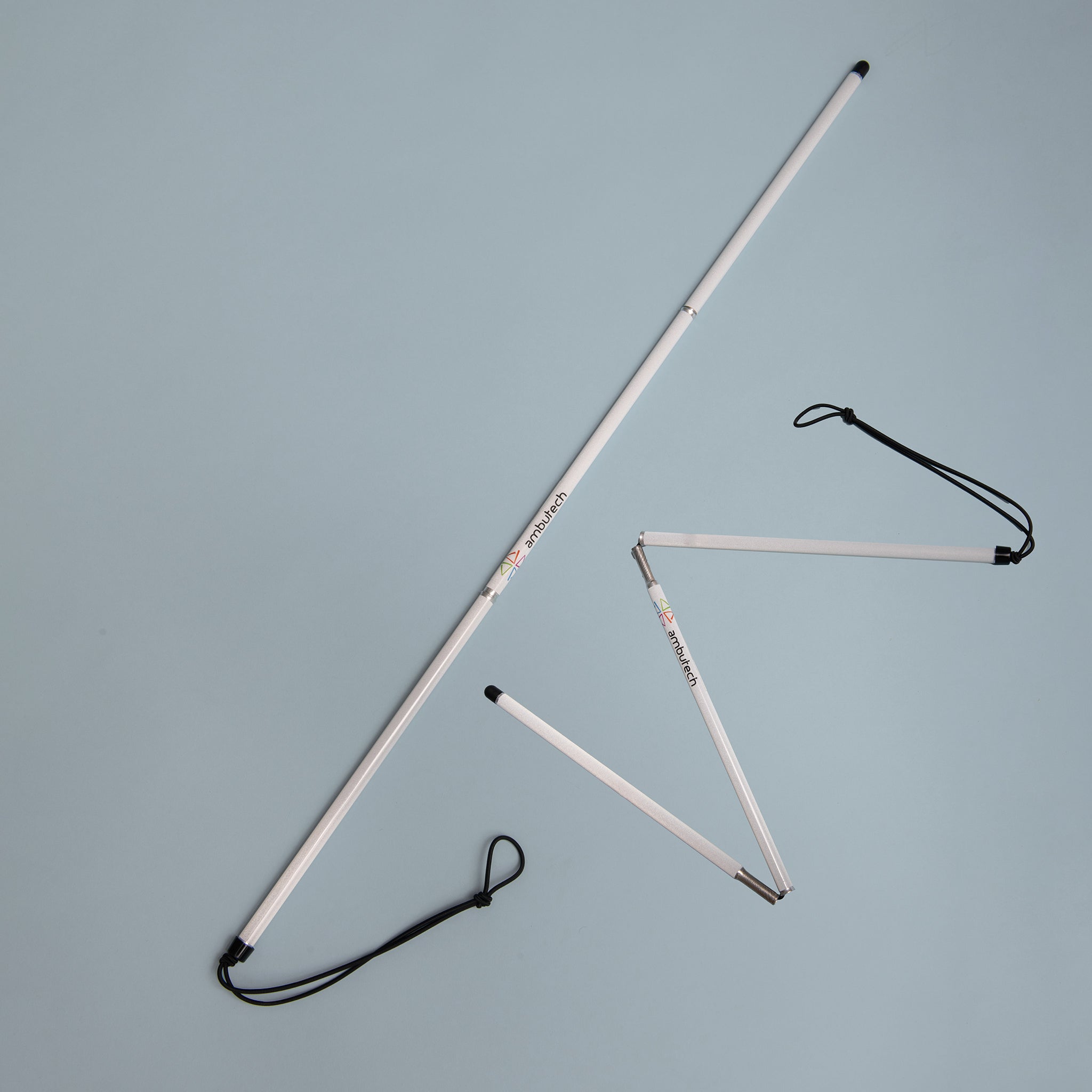 Cane unfolded and partly unfolded on a light background