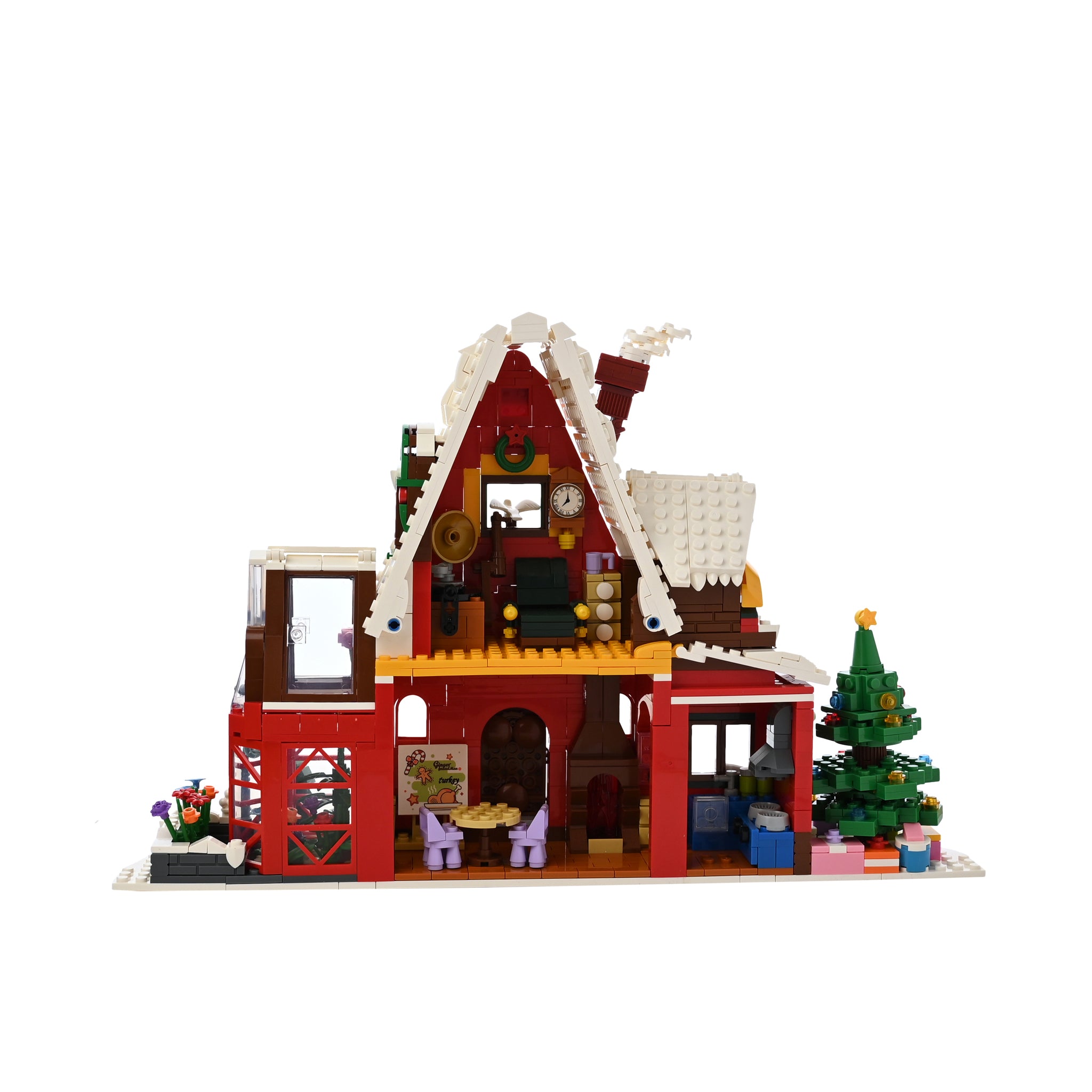 Toy house with a Christmas theme made of building blocks on a white background