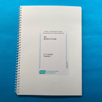 Front cover of IPA code book against a blue background