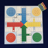 Tactile Ludo board with counters and dice.
