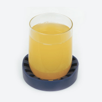 Glass of orange juice contained within the non-slip cup holder
