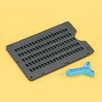 Braille frame against a yellow background