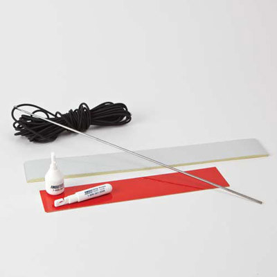 White reflective tape; red reflective tape and elastic cord on a table top
