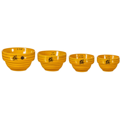 Bee hive measuring bowls against a white background