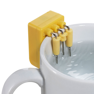Close-up of a yellow Liquid level indicator on side of a mug