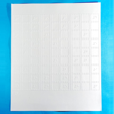 Sudoku puzzle sheets against a blue background