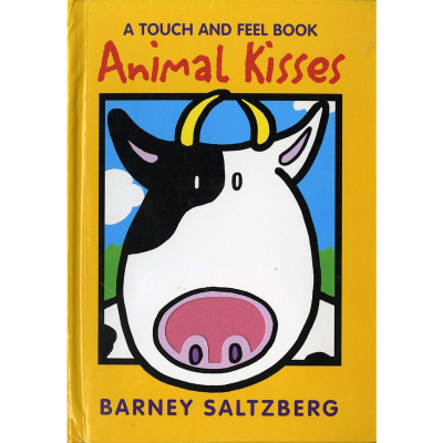 Orange front cover of the touch and feel animal kisses book with a drawing of a black and white cow