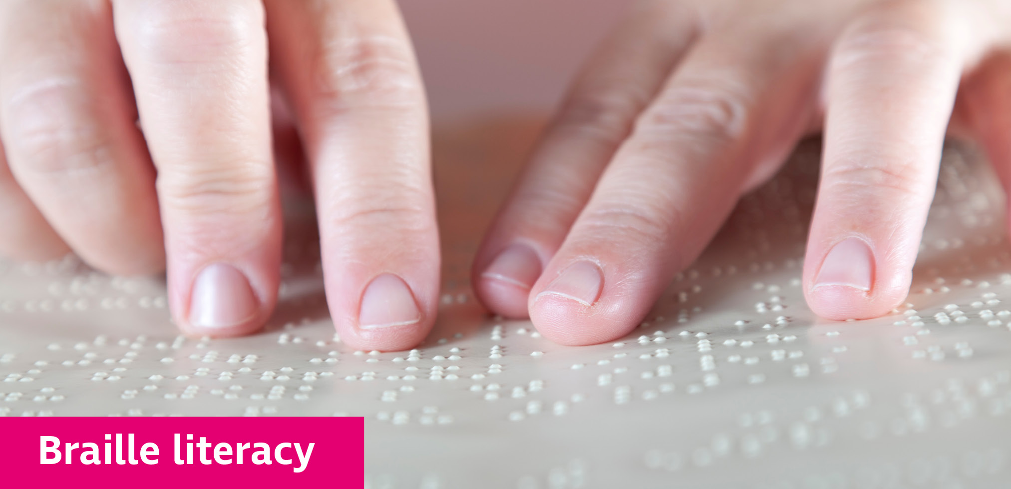 A person reading braille with both hands