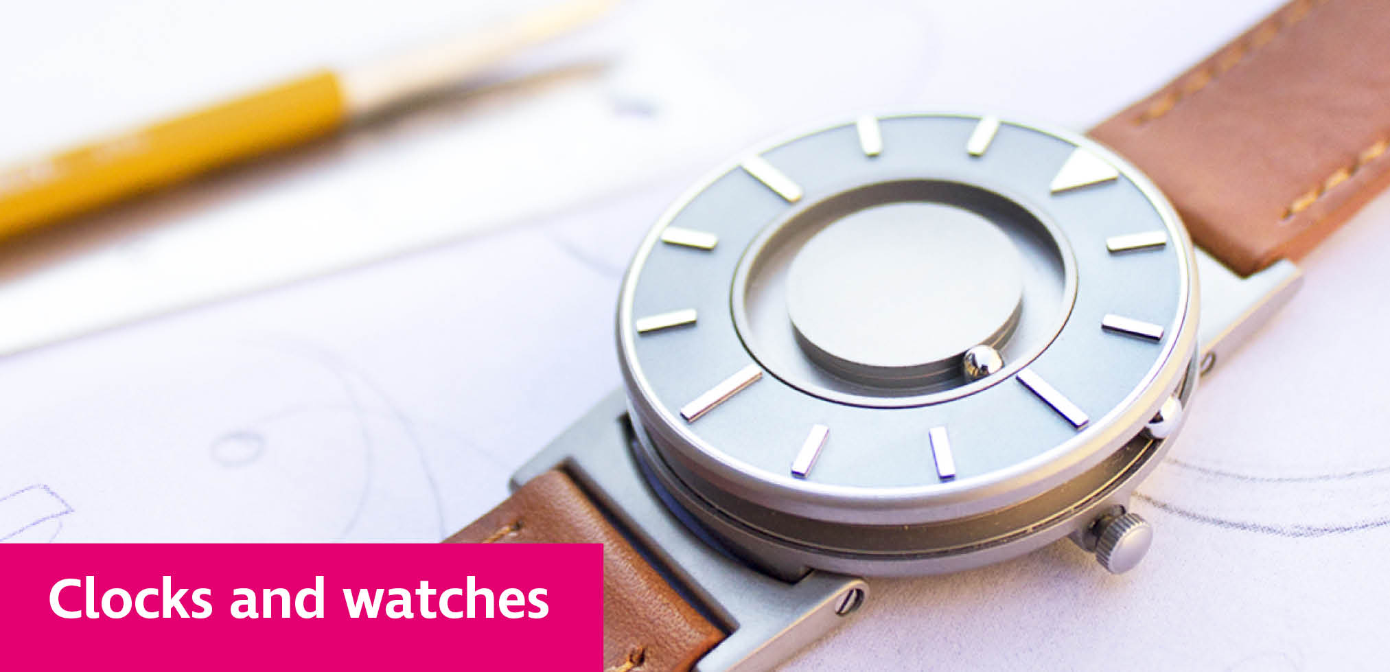 A Bradley tactile watch lying on a desk