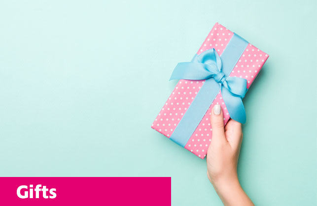 A hand holding a gift wrapped in pink and blue on a blue background