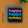 Happy Birthday card on a desk with pen next to it