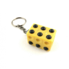Braille cube keyring on its side 