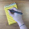 Writing in RNIB A6 Spiral Yellow notebook 