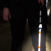 Front on view of the cane light in use with the users lower body visible behind