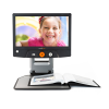 Reveal 16 video magnifier with its adjustable screen showing a person smiling 