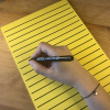 Writing on RNIB A4 Yellow writing pad