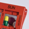 Corner of the pill organiser showing the Sunday morning compartment