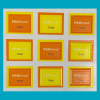 Close-up view of PenFriend tactile labels on a blue background