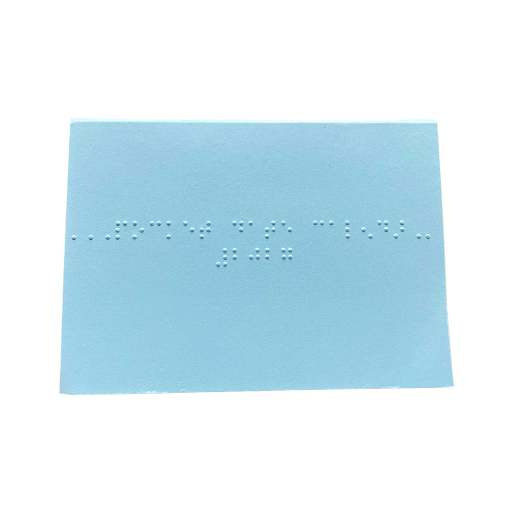 Braille pocket date calendar cover in light blue with braille text set against a white background 