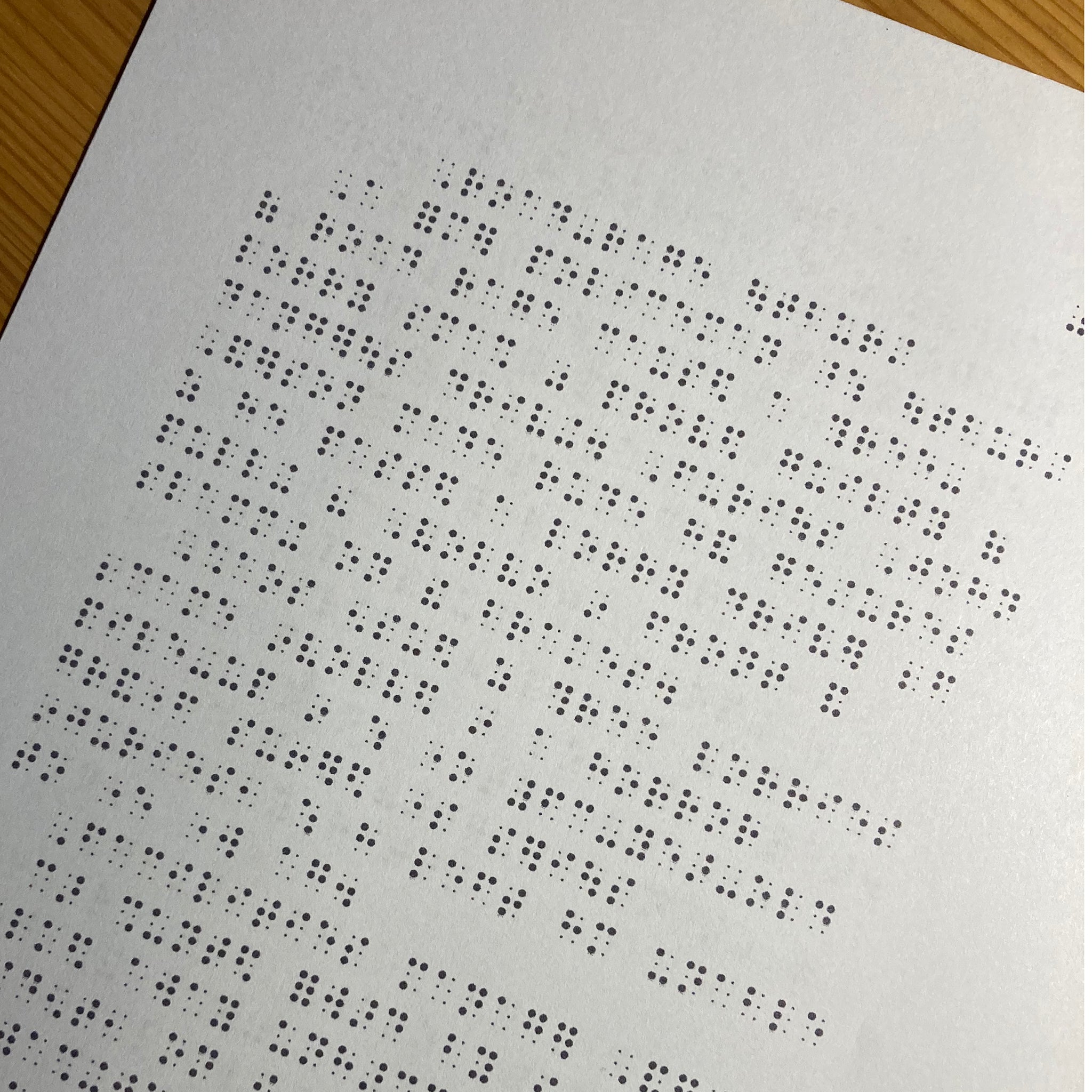 Reading exercise for sighted students learning UEB. The paper is printed with black dot simbraille.