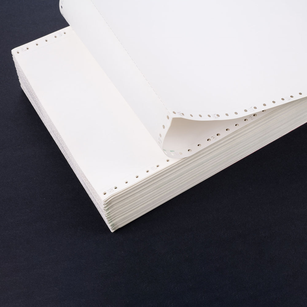 Stack of tractor-fed, white computer  paper on black background