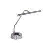 A modern silver LED desk lamp with a flexible gooseneck arm and a circular wireless charging base, shown on a plain white background.