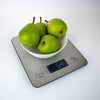 Ikonn kitchen scale with a bowl of green pears on a white background