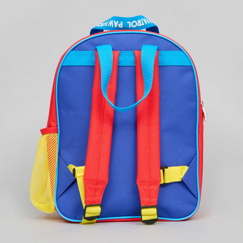 The back view of a colorful children's backpack featuring a royal blue body, red shoulder straps, bright blue top handles, yellow accents, and a yellow mesh side pocket, with 'PATROL PAW PACK' printed on the top handle.