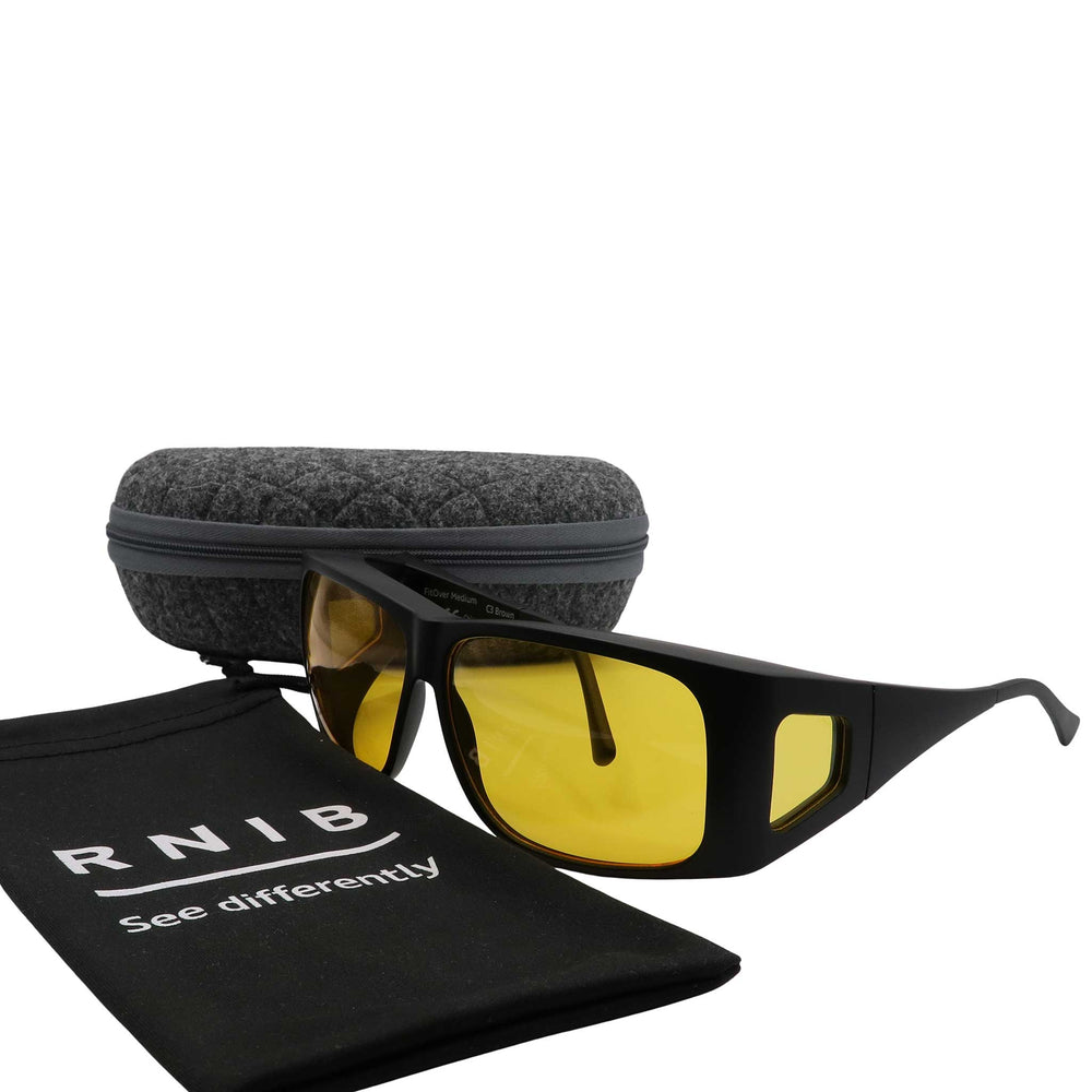 Eyeshiedls with yellow lenses and a carrying case on a white background, featuring the RNIB logo.