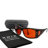 Eyeshiedls with amber lenses and a carrying case on a white background, featuring the RNIB logo.
