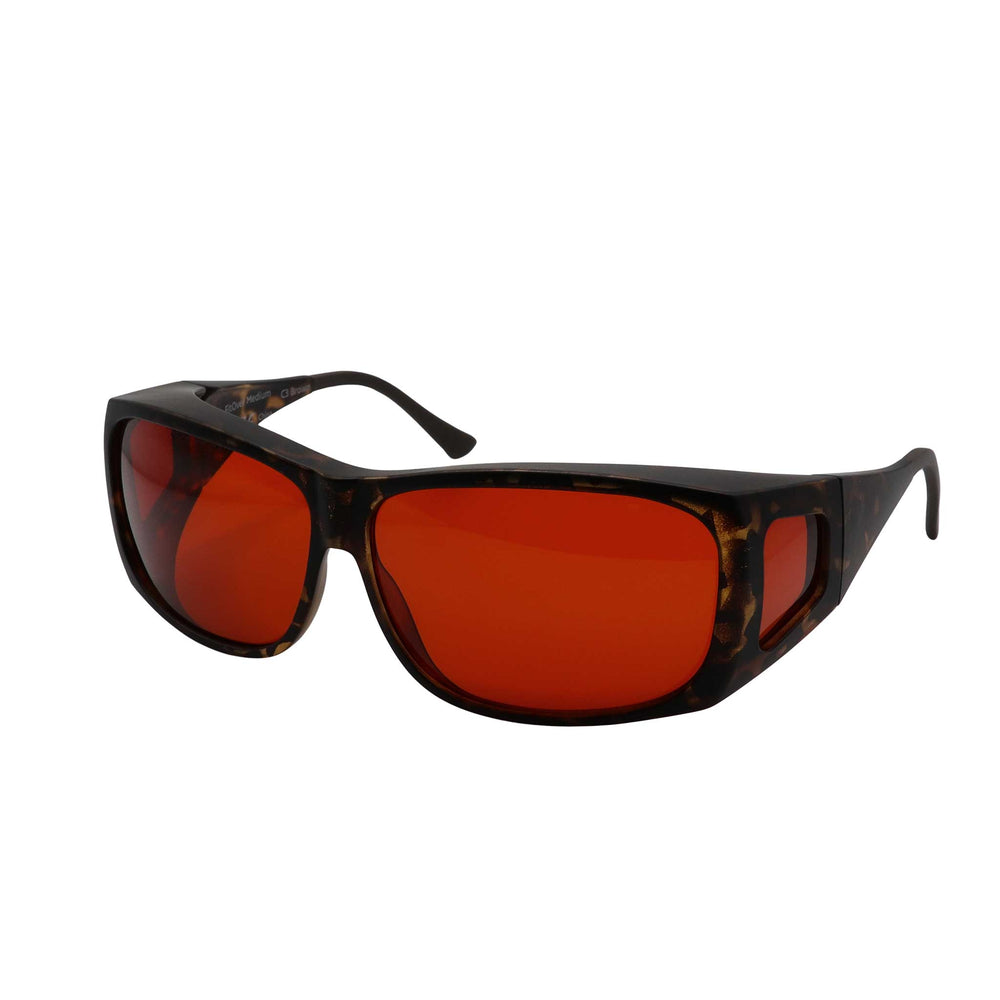 Side angled view of RNIB medium FitOver eyeshield glasses with brown tortoiseshell frames and amber tinted lenses.