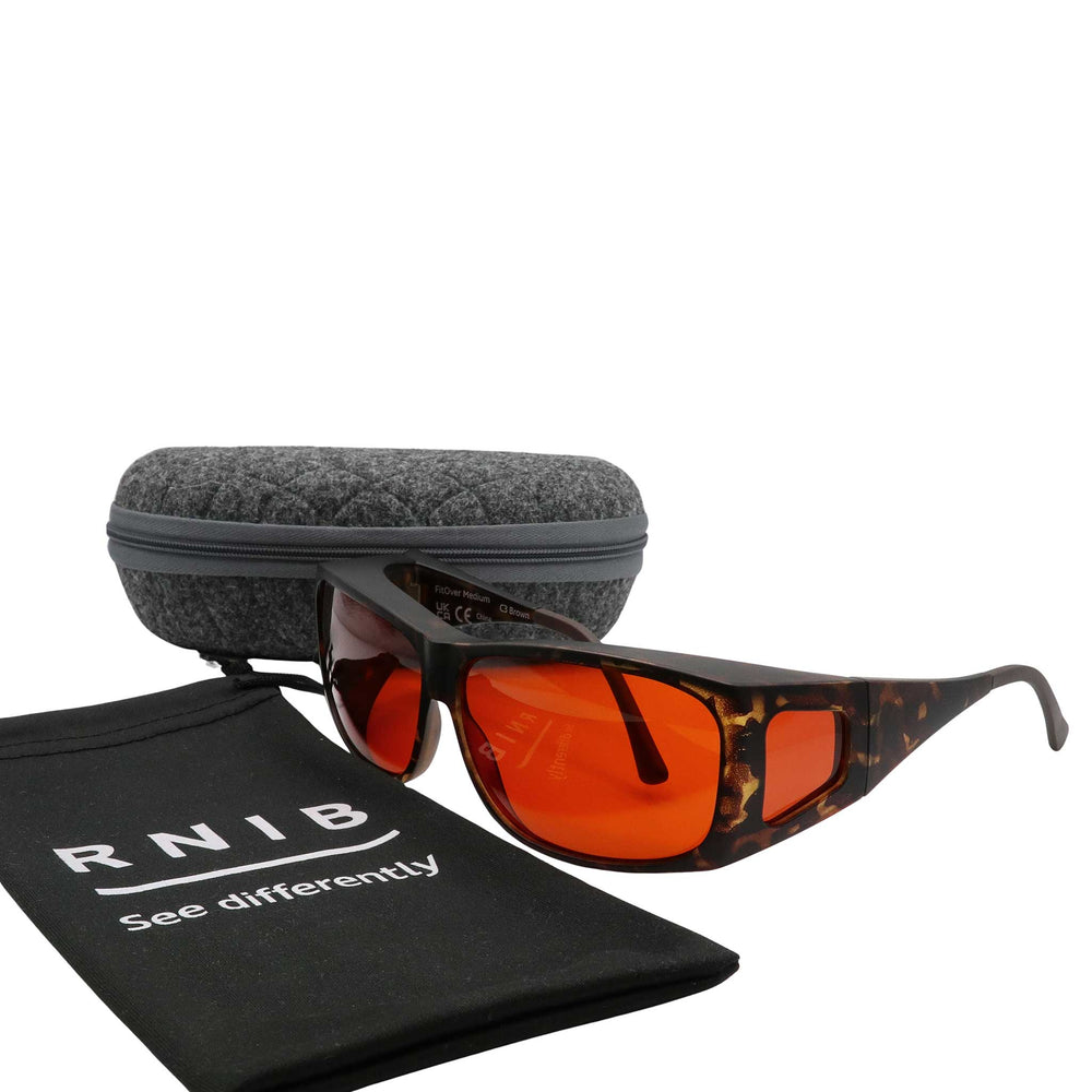 Eyeshiedls with amber lenses and a carrying case on a white background, featuring the RNIB logo.