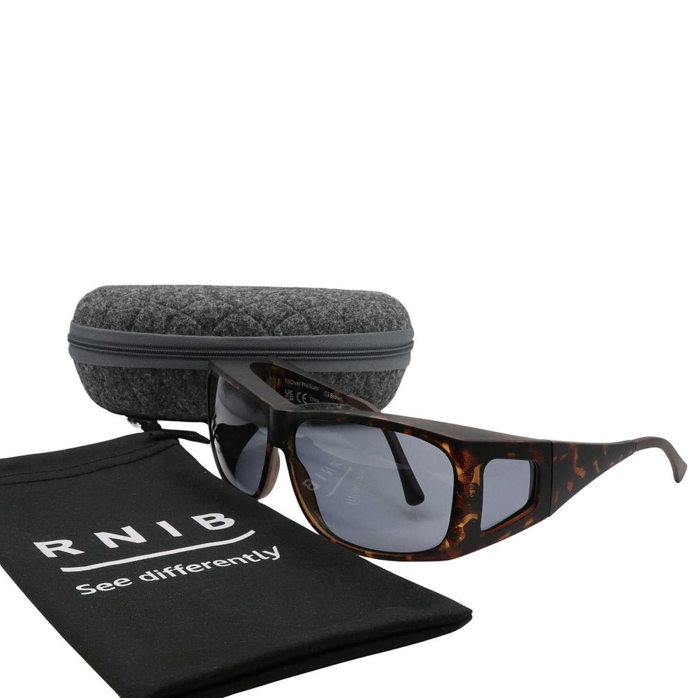 Eyeshiedls with grey lenses and a carrying case on a white background, featuring the RNIB logo.