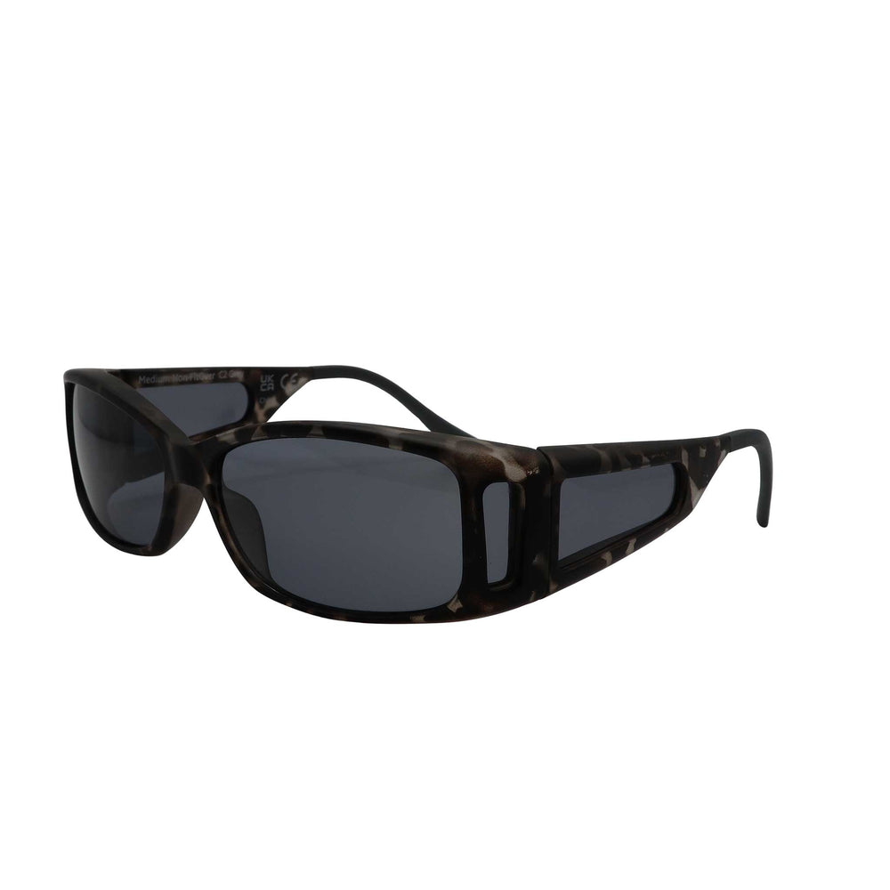 Side angled view of RNIB medium Eyeshield glasses with grey tortoiseshell frames and grey tinted lenses.