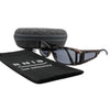 Eyeshiedls with grey lenses and a carrying case on a white background, featuring the RNIB logo.