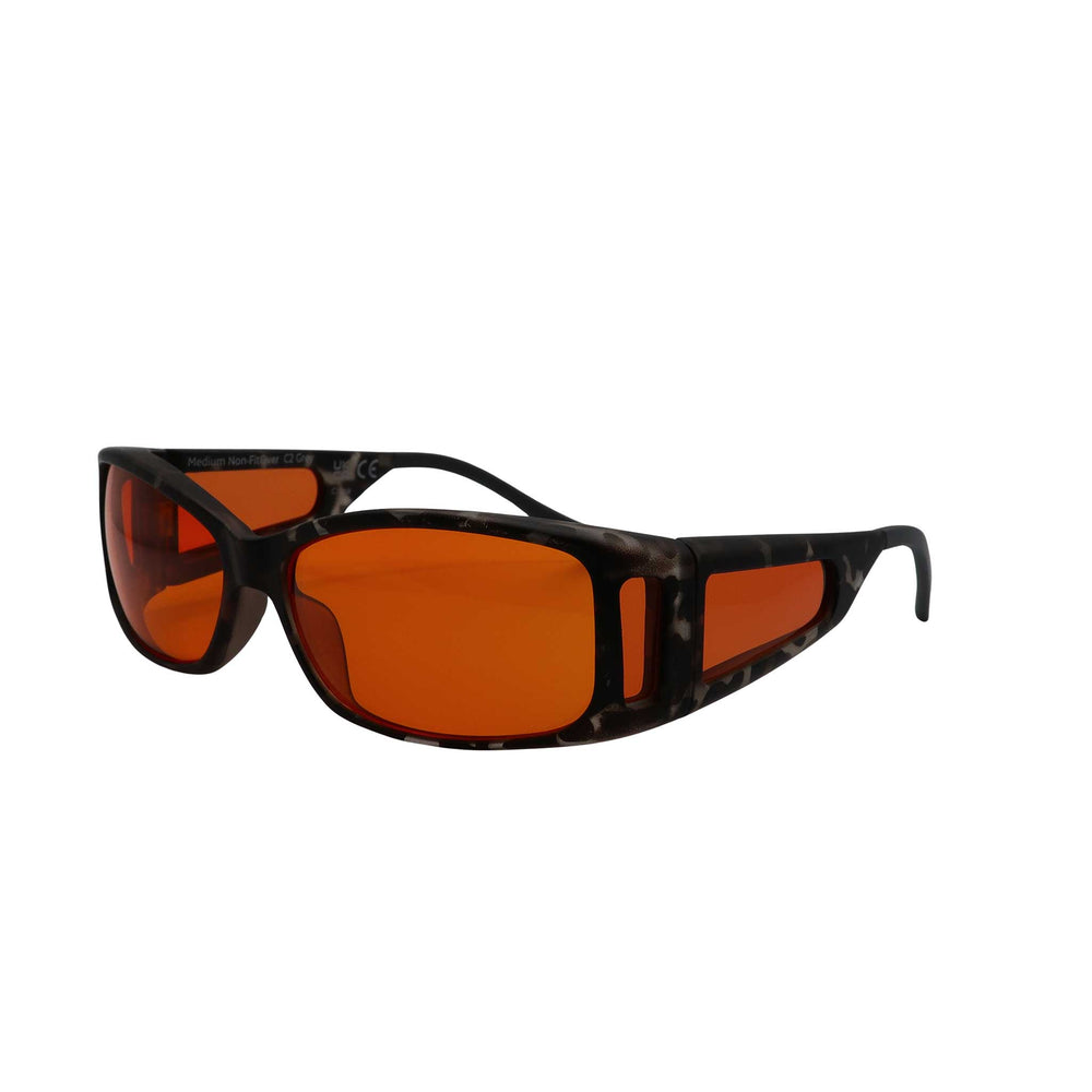 Side angled view of RNIB medium Eyeshield glasses with grey tortoiseshell frames and orange tinted lenses.