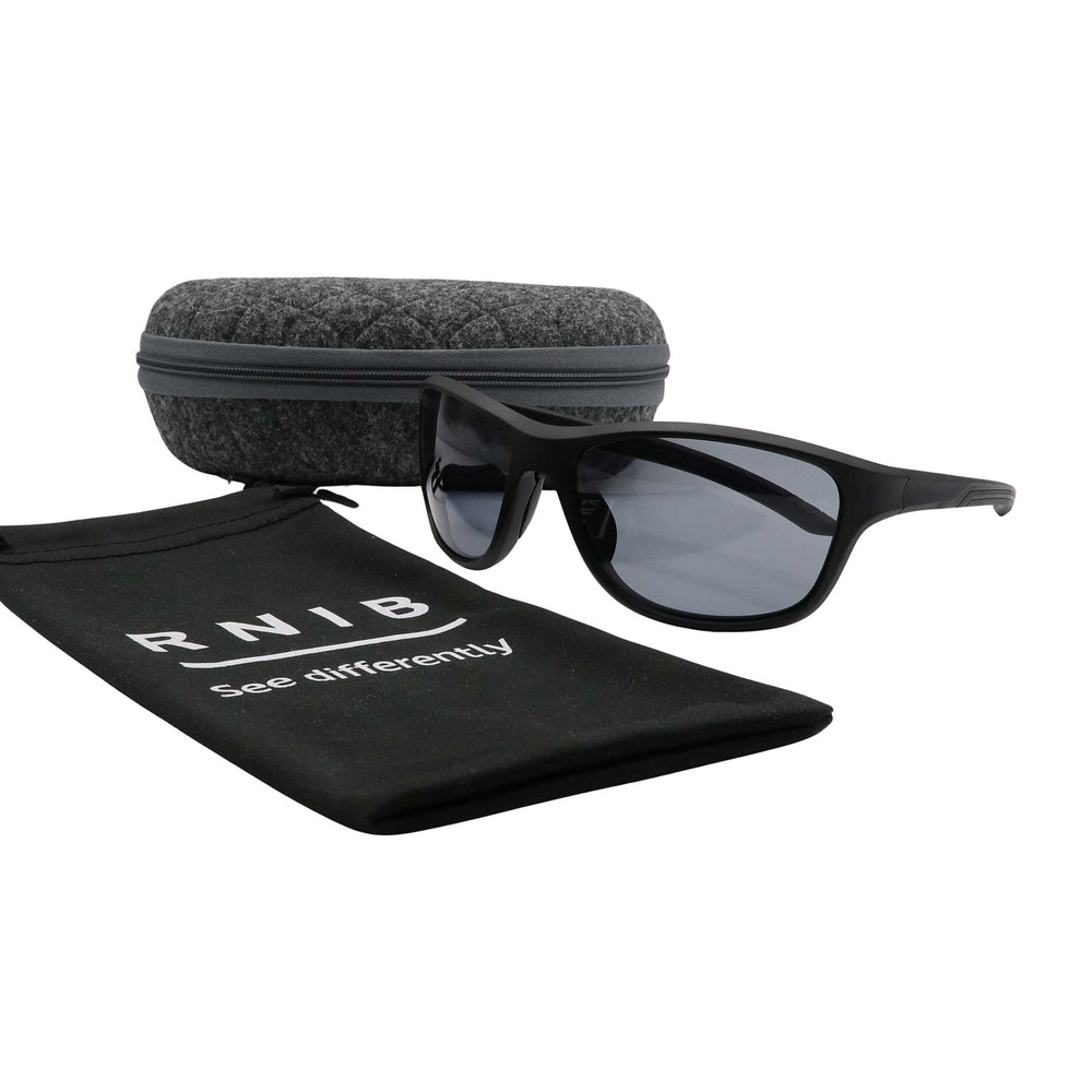 Eyeshiedls with grey lenses and a carrying case on a white background, featuring the RNIB logo.