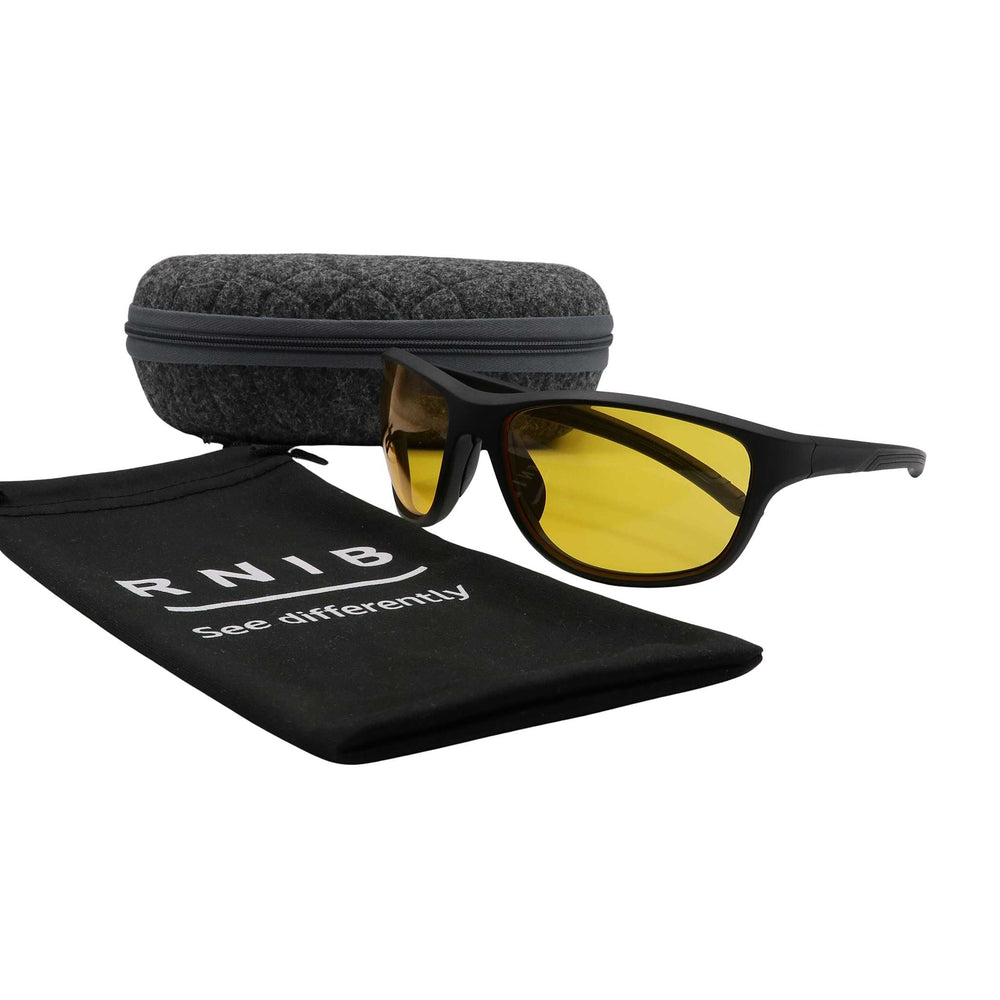 Eyeshiedls with yellow lenses and a carrying case on a white background, featuring the RNIB logo.