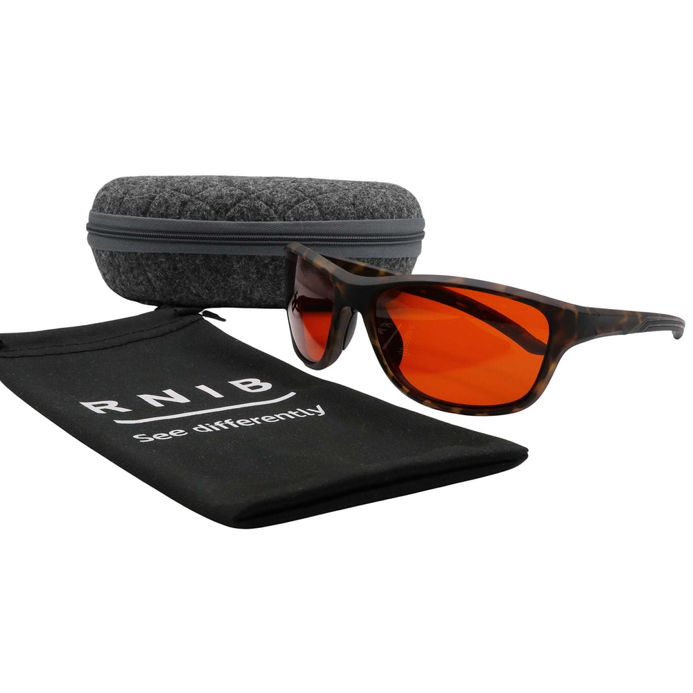 Eyeshiedls with amber lenses and a carrying case on a white background, featuring the RNIB logo.