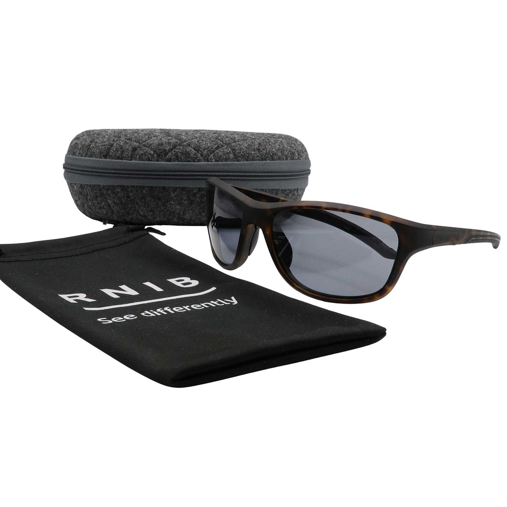 Eyeshiedls with grey lenses and a carrying case on a white background, featuring the RNIB logo.