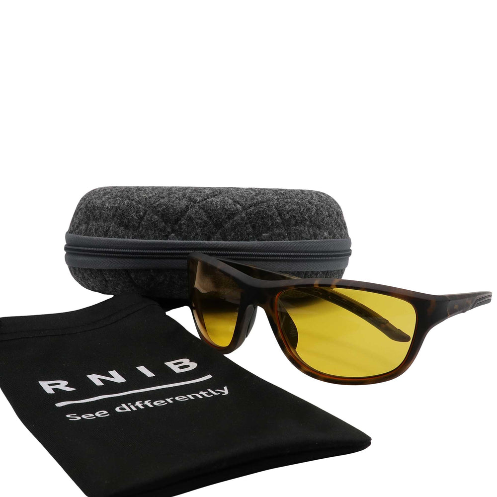 Eyeshiedls with yellow lenses and a carrying case on a white background, featuring the RNIB logo.