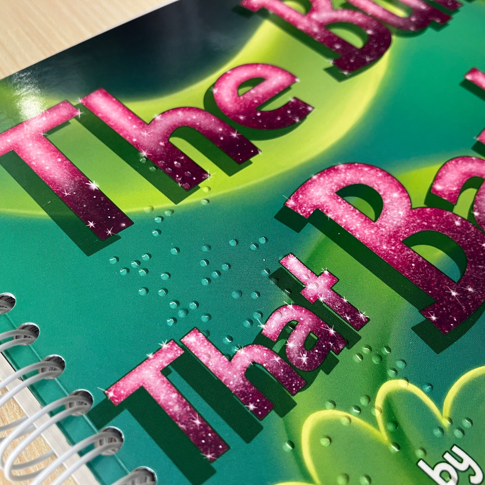 Close-up of braille on cover of The Bum That Barked