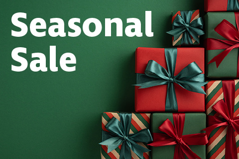 Presents wrapped in green and red are stacked to one side. On a green background is the text, in white, 'Seasonal sale'