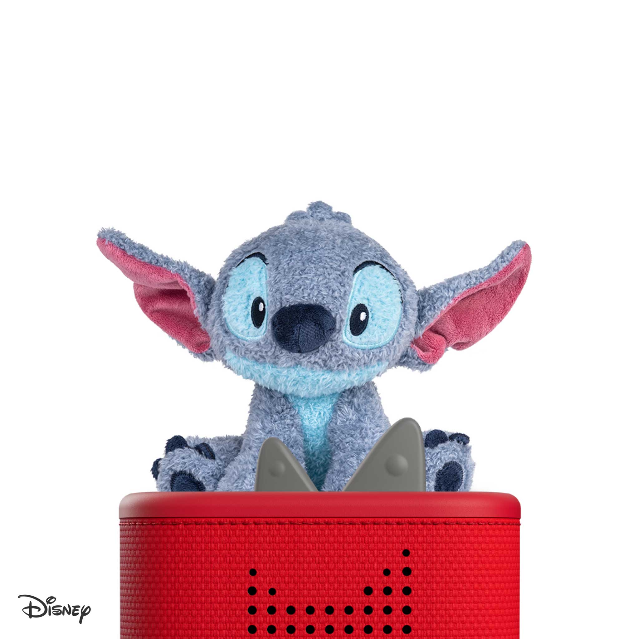 Plush toy on top of a red speaker with Disney logo.
